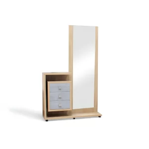 La imagen muestra un tocador moderno y elegante, que combina madera clara y detalles en gris. El tocador cuenta con un espejo alto de cuerpo entero en el lado derecho. A la izquierda del espejo, hay un módulo con tres cajones de frente gris claro y una repisa abierta en la parte superior. La base del tocador es de madera clara y está ligeramente elevada sobre pequeños pies negros.
